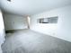 Bright living room featuring neutral carpet, freshly painted walls, and modern open design at 411 N 18Th St, Noblesville, IN 46060