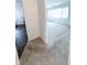 The home features a spacious living room with neutral carpet and sheer curtains at 411 N 18Th St, Noblesville, IN 46060