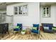 Cozy back deck furnished with comfortable seating, including blue cushioned chairs and a wicker bench at 4130 N Meridian St, Indianapolis, IN 46208