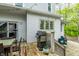 Inviting back deck featuring a grill, dining table, string lights, and access to outdoor seating at 4130 N Meridian St, Indianapolis, IN 46208