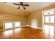 Bright bedroom with hardwood floors, two large windows, and neutral paint, creating a cozy atmosphere at 4130 N Meridian St, Indianapolis, IN 46208