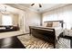 Cozy bedroom with a sled bed, zebra rug, and an adjacent sitting area with a leather couch at 4130 N Meridian St, Indianapolis, IN 46208