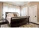Comfortable bedroom featuring a sled bed, dark wood floors, large windows, and ample closet space at 4130 N Meridian St, Indianapolis, IN 46208