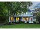 Two-story home boasting a blue front door, inviting porch, and classic charm at 4130 N Meridian St, Indianapolis, IN 46208