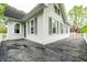Exterior shot of home showcasing a white siding and windows on a cloudy day at 4130 N Meridian St, Indianapolis, IN 46208