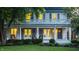 Two-story home boasting a blue front door, inviting porch, and classic charm at 4130 N Meridian St, Indianapolis, IN 46208