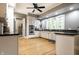 Bright kitchen with white cabinets, modern appliances, dark countertops, and ample natural light at 4130 N Meridian St, Indianapolis, IN 46208