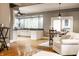 Open-concept living space with hardwood floors flowing into a kitchen with modern appliances and a breakfast bar at 4130 N Meridian St, Indianapolis, IN 46208