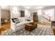 Open-concept living room with hardwood floors, stylish furnishings, and seamless flow at 4130 N Meridian St, Indianapolis, IN 46208