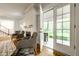Living room with french doors and view to back deck at 4130 N Meridian St, Indianapolis, IN 46208