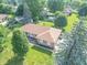 Aerial view of a charming home with well-maintained landscaping and mature trees at 425 Saddle Hill Ct, Indianapolis, IN 46234