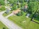 Aerial view of a charming home with well-maintained landscaping, driveway and neighborhood setting at 425 Saddle Hill Ct, Indianapolis, IN 46234