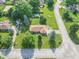 Aerial view of a charming home with well-maintained landscaping and mature trees at 425 Saddle Hill Ct, Indianapolis, IN 46234