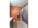 Bathroom featuring a dark vanity, patterned shower curtain, and white tiling at 425 Saddle Hill Ct, Indianapolis, IN 46234