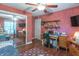 Bedroom setup featuring wood floors, sliding mirror doors, and a laptop workspace at 425 Saddle Hill Ct, Indianapolis, IN 46234