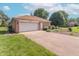 Spacious two-car garage with a paved driveway and mature landscaping at 425 Saddle Hill Ct, Indianapolis, IN 46234