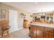 Spacious kitchen featuring granite countertops and wooden cabinets with an adjacent dining area at 425 Saddle Hill Ct, Indianapolis, IN 46234