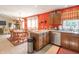 Lovely kitchen featuring warm wood cabinets, stainless steel appliances, and an island area at 425 Saddle Hill Ct, Indianapolis, IN 46234