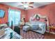 Living room space decorated in a red theme, a plush couch, and good natural lighting at 425 Saddle Hill Ct, Indianapolis, IN 46234
