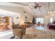 Spacious living room with vaulted ceilings, bright neutral walls, and a view to dining area at 425 Saddle Hill Ct, Indianapolis, IN 46234
