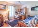 Cozy living room with a large window, a desk area, and modern decor at 425 Saddle Hill Ct, Indianapolis, IN 46234