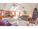Inviting living room features a vaulted ceiling, brick fireplace, and abundant natural light at 425 Saddle Hill Ct, Indianapolis, IN 46234