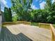 Spacious back yard with a large wood deck perfect for enjoying time outdoors with friends and Gathering at 4536 Clayburn Dr, Indianapolis, IN 46268