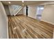 Finished basement area features hard surface floors, neutral paint and trim, and easy access to stairs at 4536 Clayburn Dr, Indianapolis, IN 46268