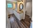 Bathroom with double vanity, granite countertop, and tile flooring, providing a touch of elegance and functionality at 4536 Clayburn Dr, Indianapolis, IN 46268