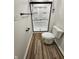 Modern bathroom with a sleek, black-framed glass shower and contemporary fixtures, offering both style and functionality at 4536 Clayburn Dr, Indianapolis, IN 46268