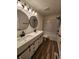 This modern bathroom features a double vanity, upgraded fixtures, and a shower/tub combo at 4536 Clayburn Dr, Indianapolis, IN 46268
