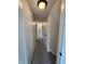 Well-lit upstairs hallway with neutral paint and carpet providing access to the bedrooms in the residence at 4536 Clayburn Dr, Indianapolis, IN 46268