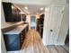 Well-appointed kitchen featuring black cabinets, stainless steel appliances, and wood-look floors for cooking and entertaining at 4536 Clayburn Dr, Indianapolis, IN 46268