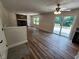 This cozy living room includes a charming brick fireplace, modern floors and access to the outdoor deck at 4536 Clayburn Dr, Indianapolis, IN 46268
