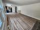 Spacious living room features stylish wood-look flooring and neutral paint, creating a bright and inviting atmosphere at 4536 Clayburn Dr, Indianapolis, IN 46268