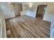 The living room features wood-look flooring, neutral paint, and decorative molding for a modern yet cozy feel at 4536 Clayburn Dr, Indianapolis, IN 46268