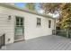 Exterior of the home showing a back door accessing a well-maintained deck at 5315 Rosslyn Ave, Indianapolis, IN 46220