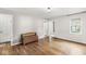 The bedroom has hardwood floors and a neutral color pallet and a double door closet at 5315 Rosslyn Ave, Indianapolis, IN 46220