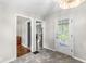 Hallway connecting kitchen and living space, featuring exterior access door at 5315 Rosslyn Ave, Indianapolis, IN 46220