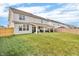 Spacious backyard with a well-maintained lawn, patio, and privacy fence at 5353 Hibiscus Dr, Plainfield, IN 46168