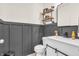 Stylish half bathroom with modern fixtures, floating shelves, and a sleek design for a touch of elegance and convenience at 5353 Hibiscus Dr, Plainfield, IN 46168