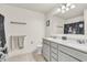 Well-lit bathroom with double vanity, marble countertop, and neutral color scheme at 5353 Hibiscus Dr, Plainfield, IN 46168