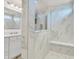 Modern bathroom with white marble tile shower and vanity at 5353 Hibiscus Dr, Plainfield, IN 46168