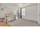 Bright bedroom featuring neutral walls and decor, a modern desk, and a ceiling fan with light at 5353 Hibiscus Dr, Plainfield, IN 46168