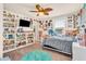 Eclectic bedroom with an array of decorations and stuffed animals at 5353 Hibiscus Dr, Plainfield, IN 46168