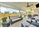 Covered patio with comfortable seating, ceiling fans and string lights, ideal for relaxing at 5353 Hibiscus Dr, Plainfield, IN 46168