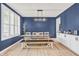 Elegant dining room with a modern chandelier, large window with shutter, and a cozy setting for Gathering gatherings at 5353 Hibiscus Dr, Plainfield, IN 46168