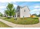 Well-manicured lawn and landscaping surrounding this traditional-style two-story home at 5353 Hibiscus Dr, Plainfield, IN 46168