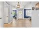 Bright and airy foyer with hardwood floors, neutral paint, and an inviting atmosphere, perfect for welcoming guests at 5353 Hibiscus Dr, Plainfield, IN 46168