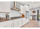 This open kitchen features white cabinets, granite countertops, and stainless steel appliances at 5353 Hibiscus Dr, Plainfield, IN 46168